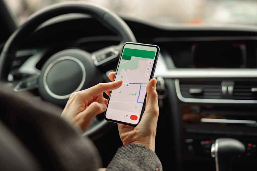 5 Taxi Booking and Fleet App Tutorials closeup of female traveler using cell phone with g 2023 03 17 23 18 38 utc